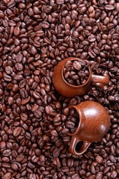 Background of coffee beans with cup Stock Photos