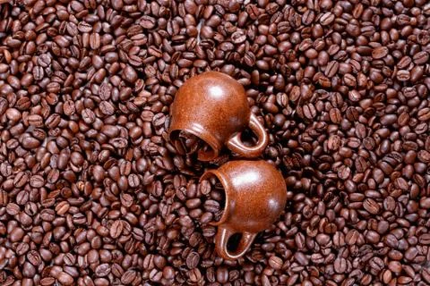 Background of coffee beans with cup Stock Photos