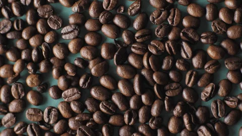 Background of coffee beans on a dark turquoise background. Stock Footage 268412259