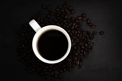 Background From Coffee Grains And A Cup From Coffee, The Top View Stock Photos