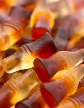 A Background of Cola Flavored Gummies Foto stock