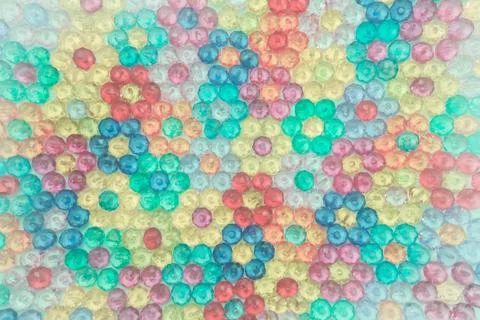 Background of colored beads, background of flowers made of colored beads Stock Photos