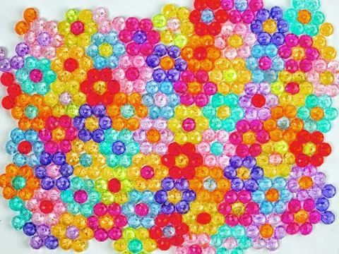 Background of colored beads, background of flowers made of colored beads Stock Photos