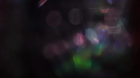 Background of colored lights with white light overlay moving in the dark Видео 318510930