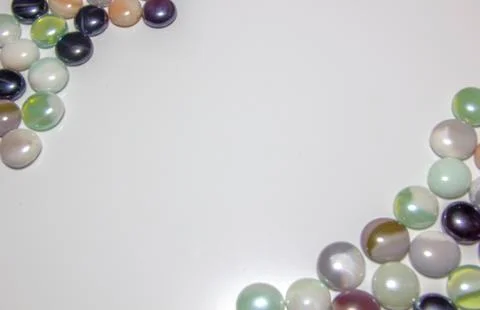 Background of colored round smooth colored stones with a place under the insc Stock Photos