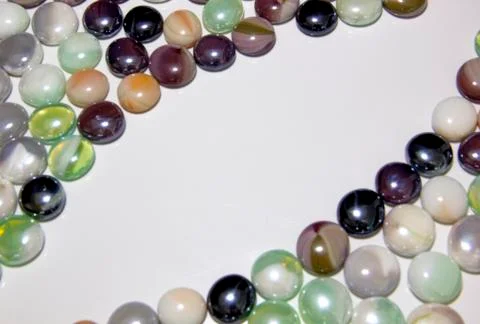 Background of colored round smooth colored stones with a place under the insc Stock Photos