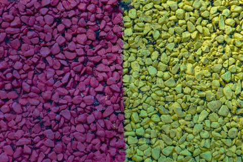 Background of colored small pebbles. The background is divided into two halves Stock Photos