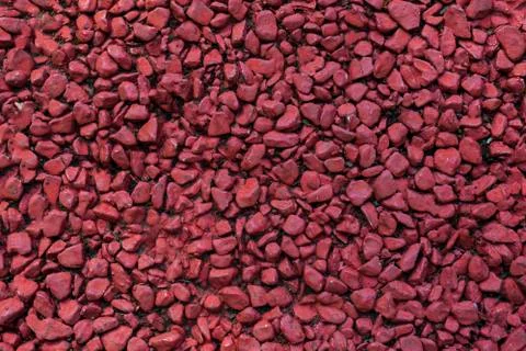 Background of colored small pebbles. The background red. Stock Photos