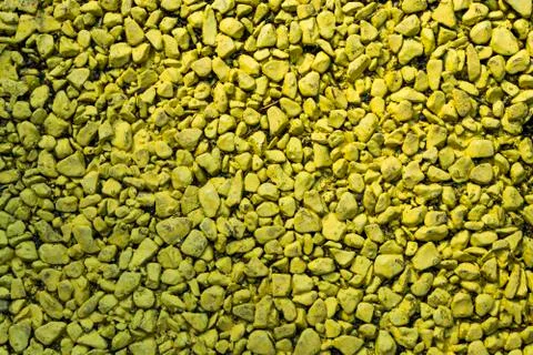 Background of colored small pebbles. The background yellow. 스톡 사진