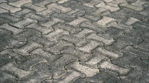 Background of colored stone tiles on the sidewalk. Grey stone blocks on a day Stock Footage 170507690