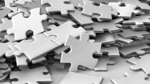 Background of Colored white Puzzle Pieces that Slowly Rotating Clockwise - Top Video stock 336248525