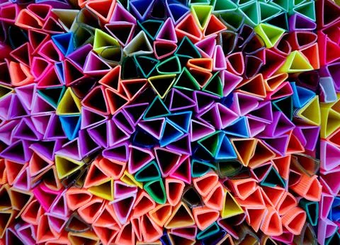 Background of colorful abstract texture with plastic triangles Stock Photos