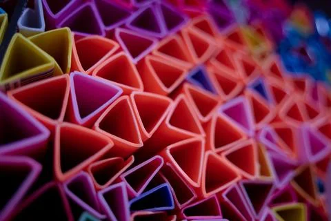 Background of colorful abstract texture with plastic triangles 스톡 사진