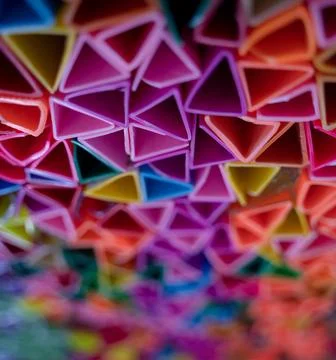Background of colorful abstract texture with plastic triangles 스톡 사진