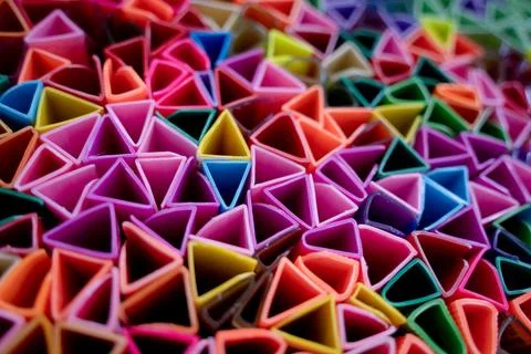 Background of colorful abstract texture with plastic triangles Stock Photos