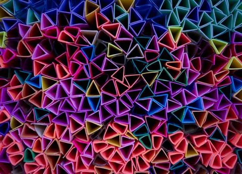 Background of colorful abstract texture with plastic triangles Stock Photos