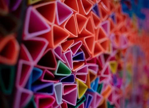 Background of colorful abstract texture with plastic triangles 스톡 사진