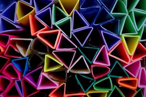 Background of colorful abstract texture with plastic triangles Stock Photos