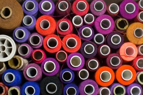 Background of colorful spools of thread Stock Photos