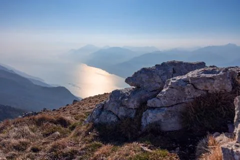 Background composition of stones and a view of Lake Garda Foto stock