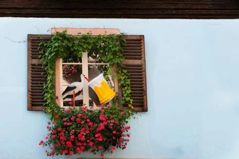 Background concept for presentation, with a stork in front of window Stock Photos