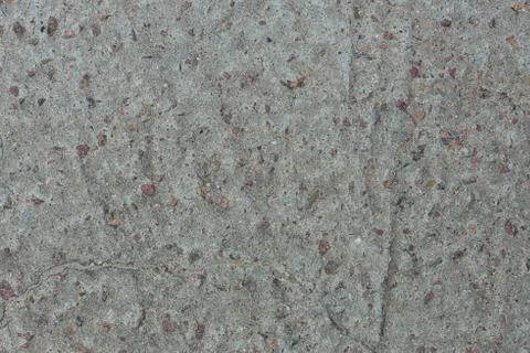 Background from concrete with impregnations from red granite gravel with an Stock Photos