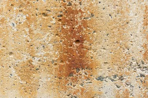 Background is a concrete rusty surface. the textured cement wall is covered w Stock Photos