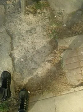 Background with concrete in a sidewalk with different elements in daylight Fotos Stock