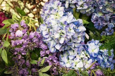 Background consists of artificial flowers. Foto stock