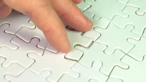 The background consists of puzzle elements. A lot of gold puzzle elements on a Stock-Footage 336248441