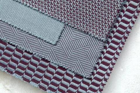 The background consists of several types of colored tiles with different Foto stock