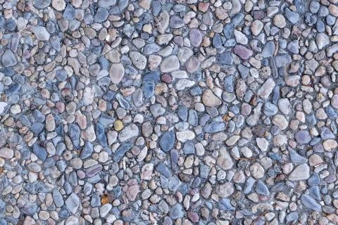 Background with contrasting texture of small colored stones Stock Photos