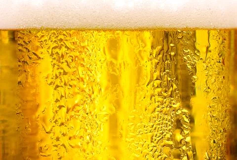 Background Cool beers with beer bubbles on top a glass at the party Stock Photos