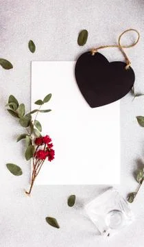 Background with copy space blank on table with black heart, eucalyptus branch Stock Photos