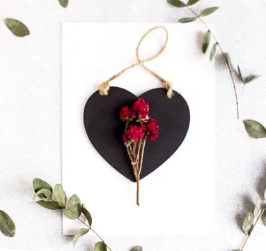 Background with copy space blank on table with black heart, eucalyptus branch Stock Photos