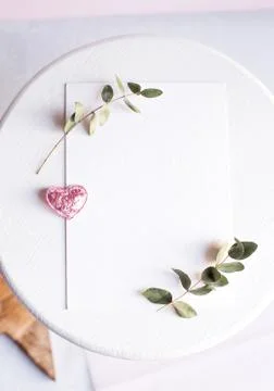 Background with copy space blank on white table with glitter heart, eucalyptu Stock Photos