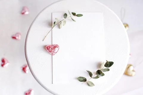 Background with copy space blank on white table with glitter heart, eucalyptu Stock Photos