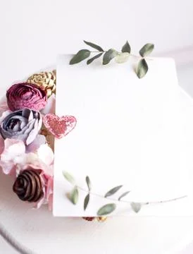 Background with copy space blank on white table with glitter heart, eucalyptu Stock Photos
