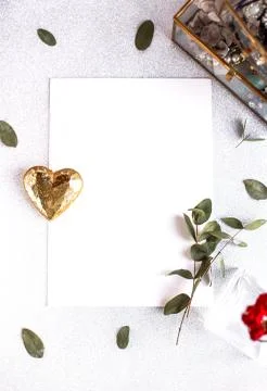Background with copy space blank on white table with glitter heart, eucalyptu Stock Photos
