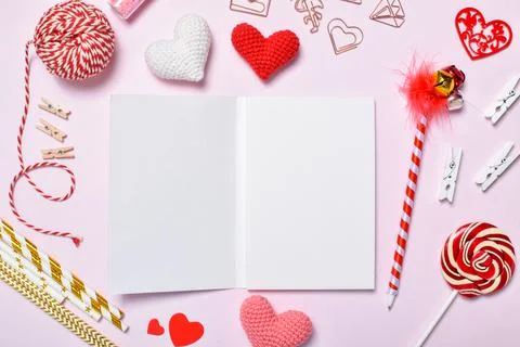 Background for a copy space for Valentine's Day with gifts and knitted hearts. Stock Photos