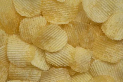 Background corrugated golden chips with texture 스톡 사진