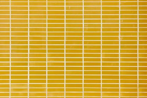 Background created with a close-up of an exterior wall with orange tiles of.. Stock Photos