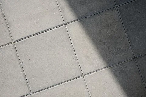 Background created by a close-up of a stone pavement. Stock Photos