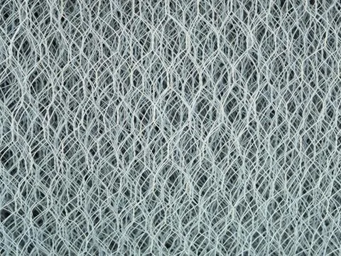 Background created by texture of metal net Stock Photos