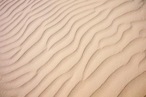 Background created using a close-up of a rippled sand dune on the coast of .. Stock Photos