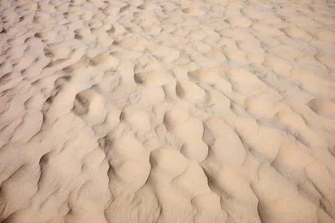 Background created using a close-up of a rippled sand dune on the coast of .. Stock Photos