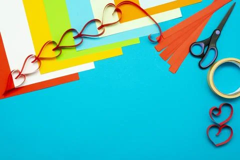 Background for creativity. Colored paper and paper hearts. Cut out of paper Stock Photos