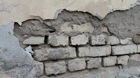 Background of a crumbling brick wall close-up. The texture of a crumbling wall Stock Footage 264160201
