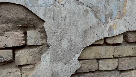 Background of a crumbling brick wall close-up. The texture of a crumbling wall Stock Footage 272967743