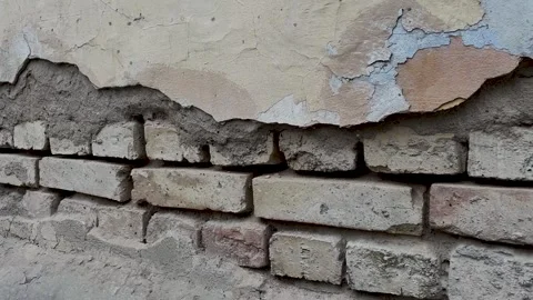 Background of a crumbling brick wall close-up Vídeos de archivo 298521765